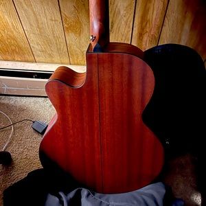 A new Jasmine acoustic guitar with black carry case